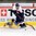 LUCERNE, SWITZERLAND - APRIL 16: Sweden's Jesper Lindgren #27 falls to the ice while Slovakia's Marek Sloboda #18 plays the puck during preliminary round action at the 2015 IIHF Ice Hockey U18 World Championship. (Photo by Matt Zambonin/HHOF-IIHF Images)

